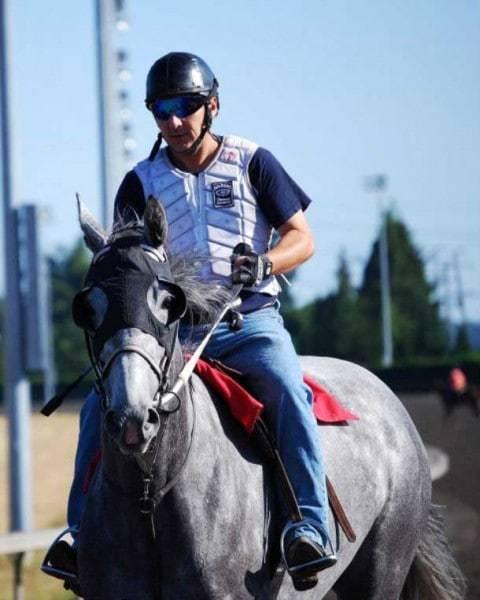 Rider Jamie Comber rides the grey Thoroughbred mare Litdeworldonfire at Emerald Downs Race Track