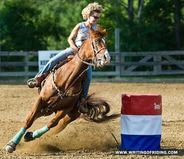 This barrel racer looks delighted, but her barrel horse looks the opposite.